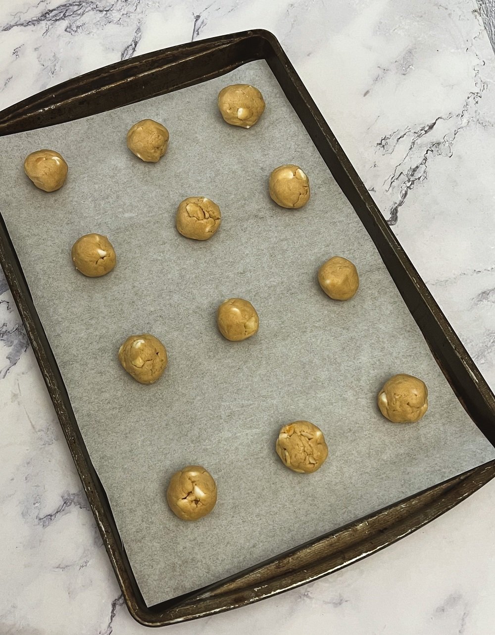 White chocolate macadamia nut cookies on pan