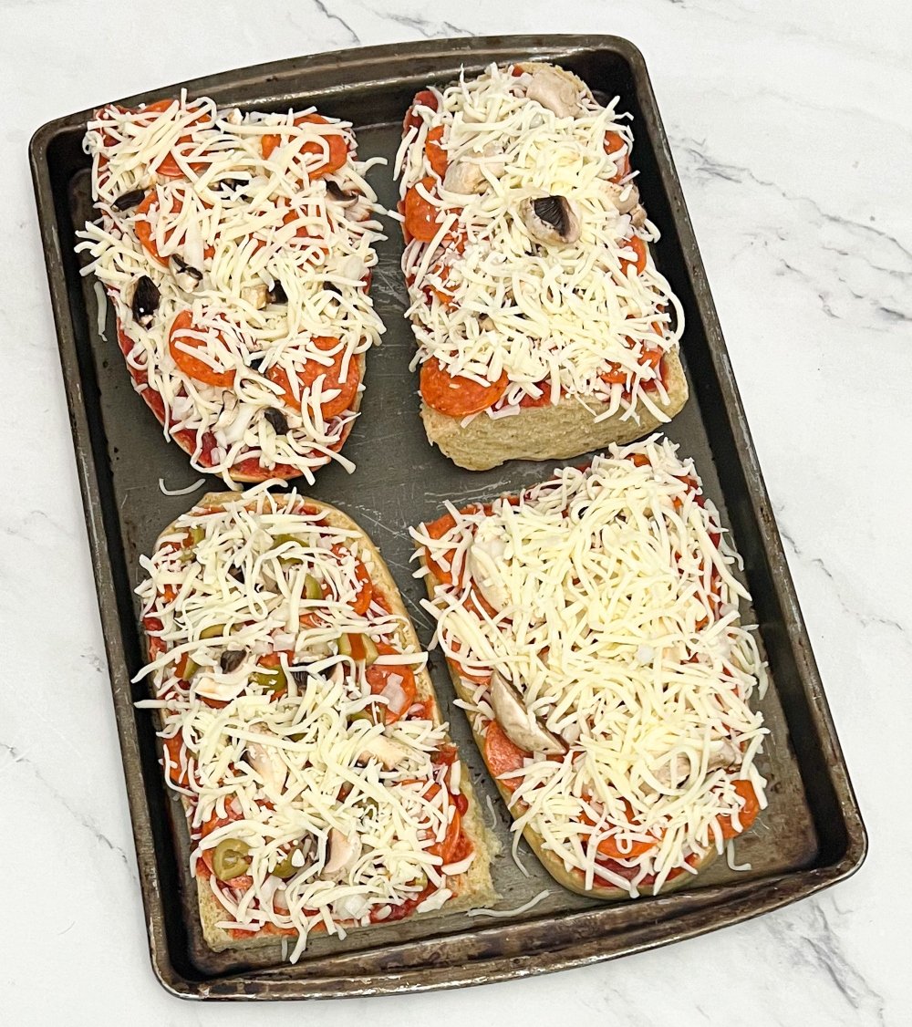 french bread pizza on baking sheet