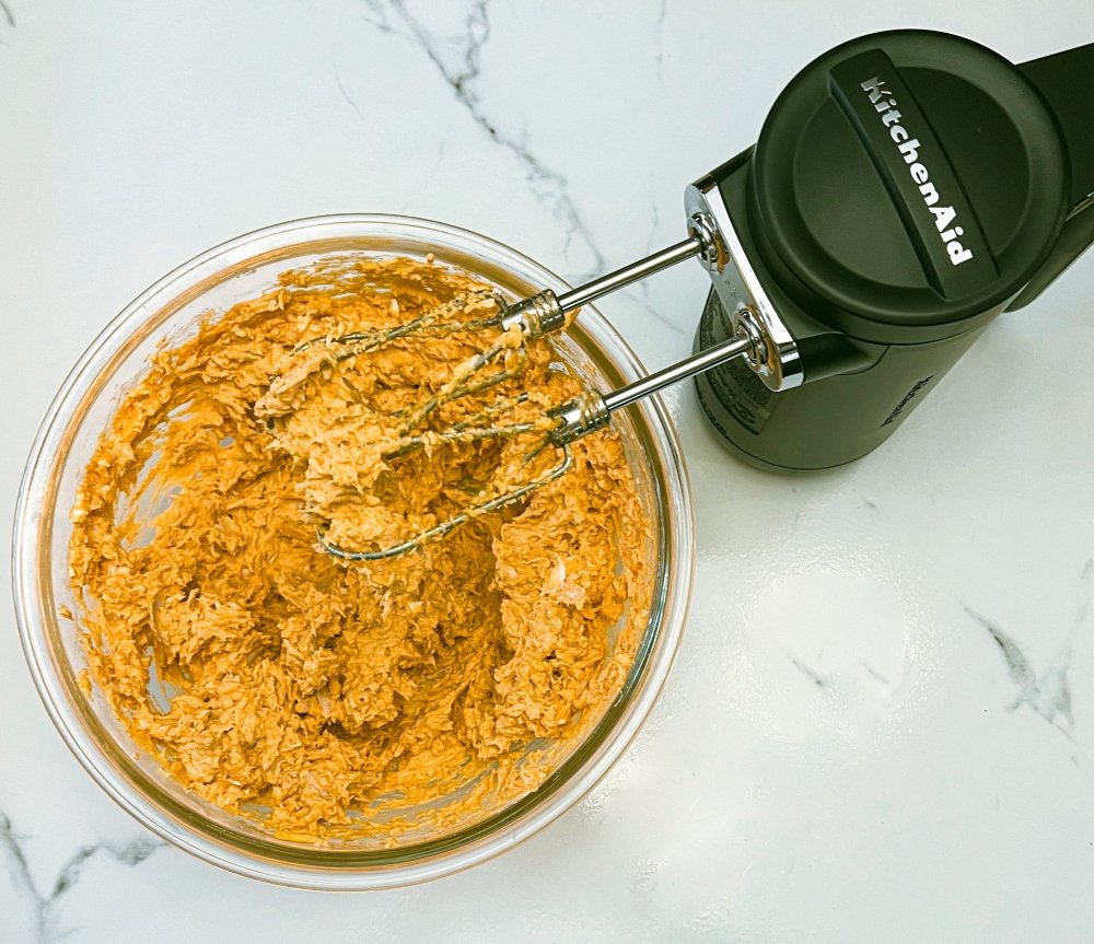 mixing buffalo chicken dip