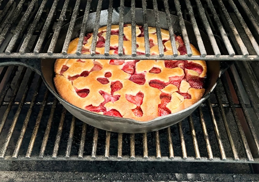 skillet strawberry cobbler baking on smoker