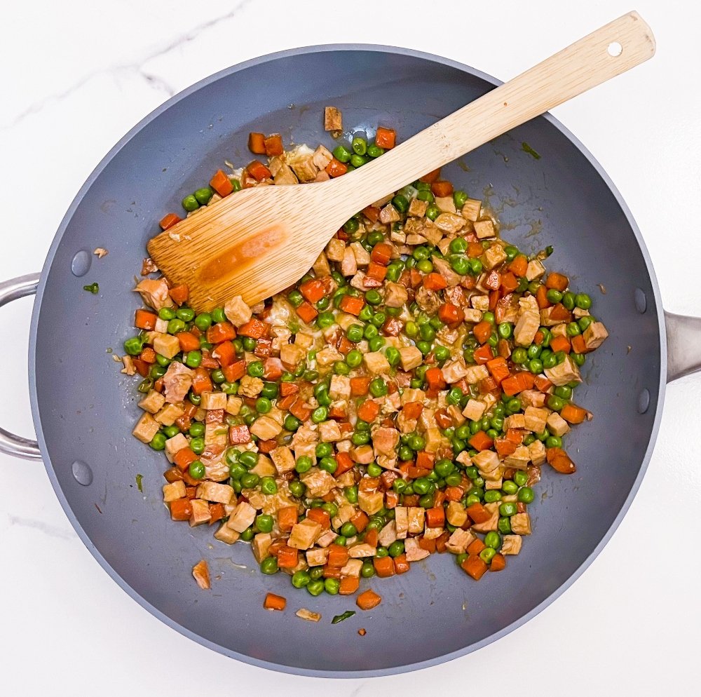 Adding egg to the wok