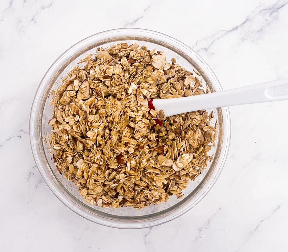 Rolled oats and almonds mixed with honey and coconut oil