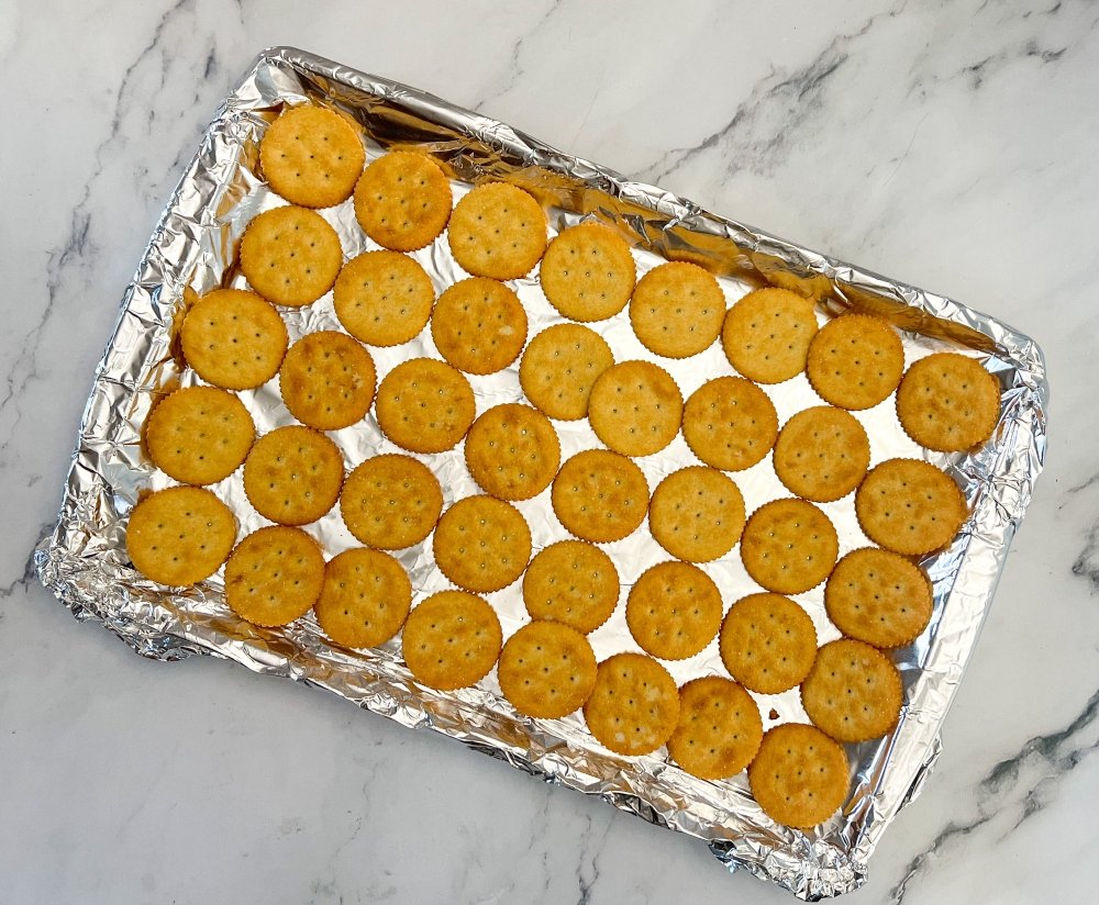 Ritz crackers on baking sheet