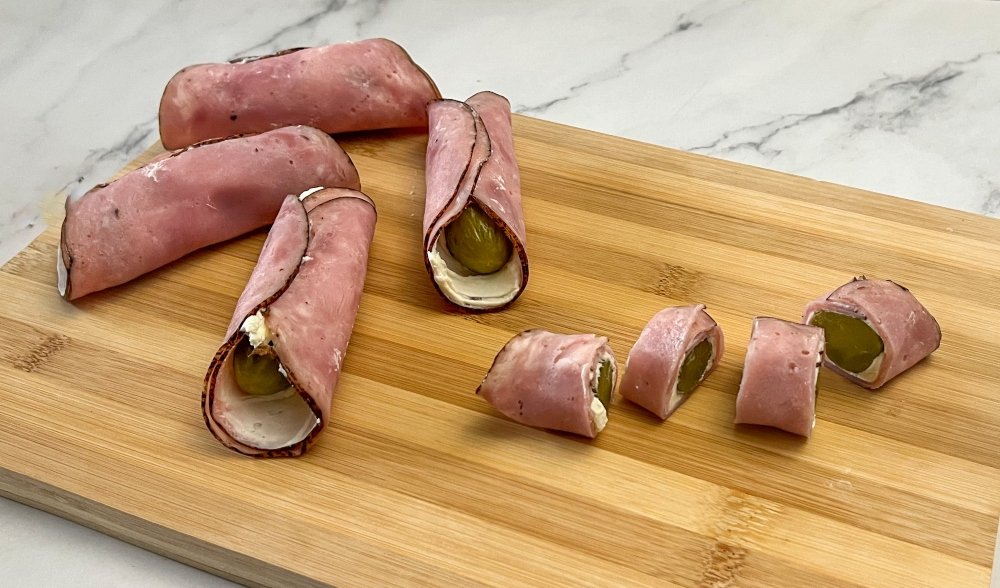 Slicing ham and pickle rollups