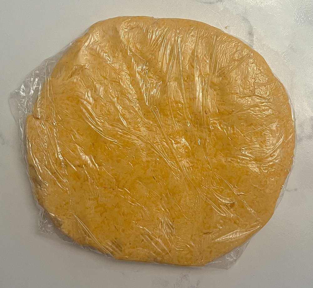 Cover dough in plastic wrap