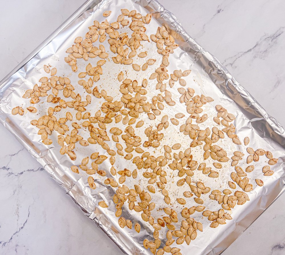 Pumpkin seeds on baking sheet