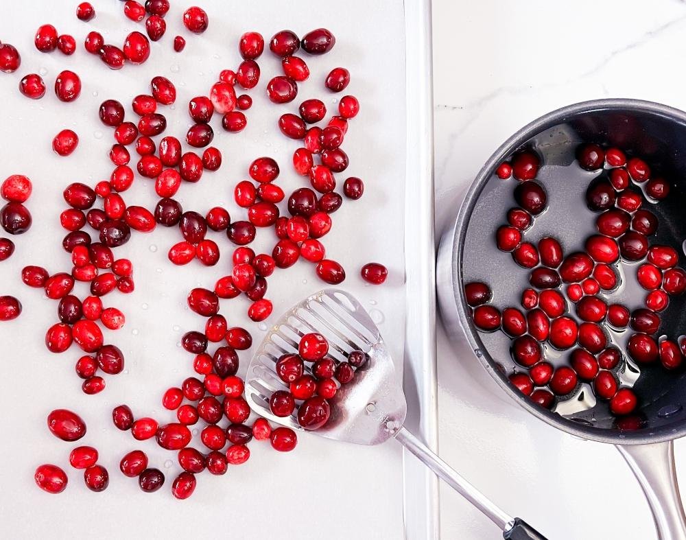 Draining cranberries on parchment paper