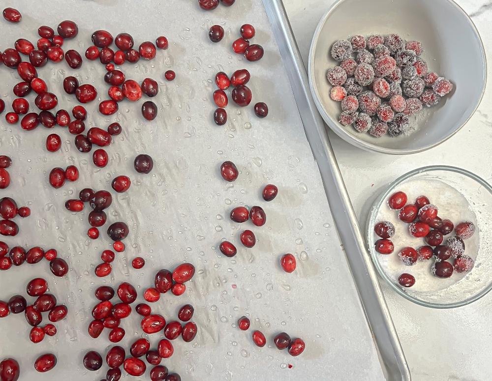 Rolling cranberries in sugar