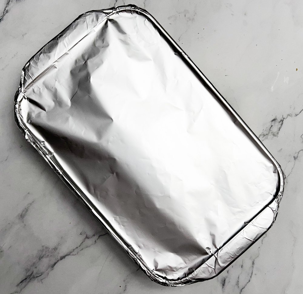 Baking dish covered in aluminum foil