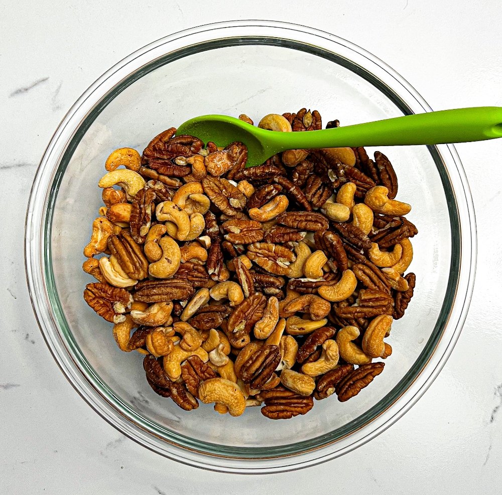 Pecans and cashews in a mixing bowl