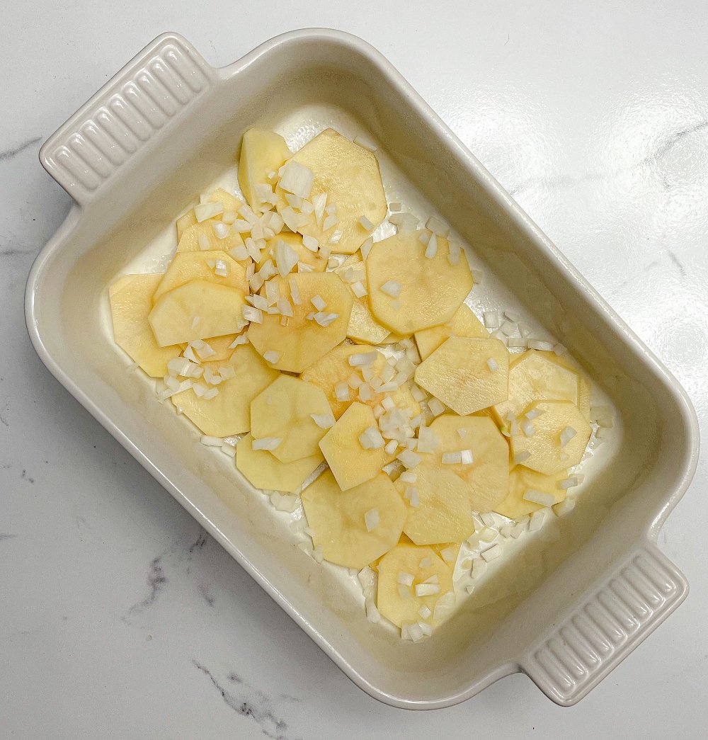 Sliced potatoes in baking dish